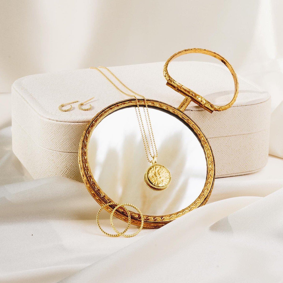 Beaded Collection as shown with a little round mirror and a white jewelry case Katie Dean Jewelry