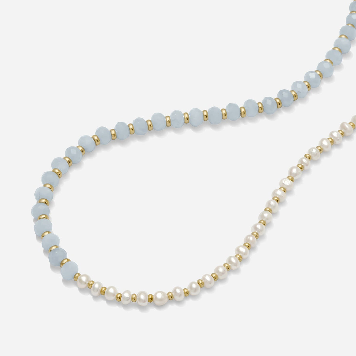 Asymmetrical Pearl & Blue Gemstone Necklace handmade by katie dean jewelry on a white background.