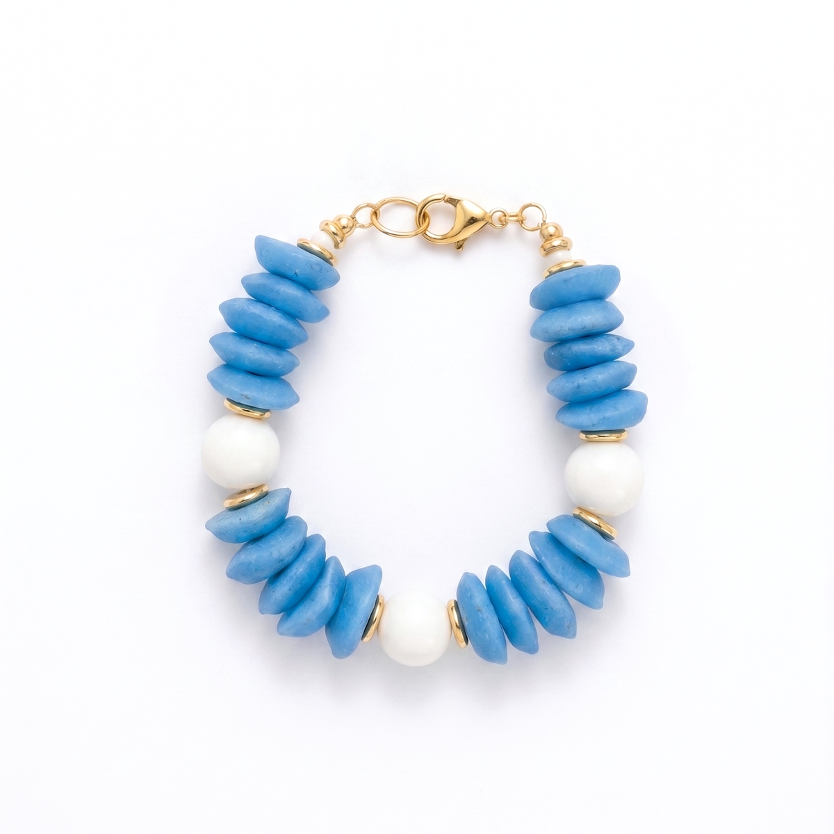 Bracelet with blue and white beads on a white background