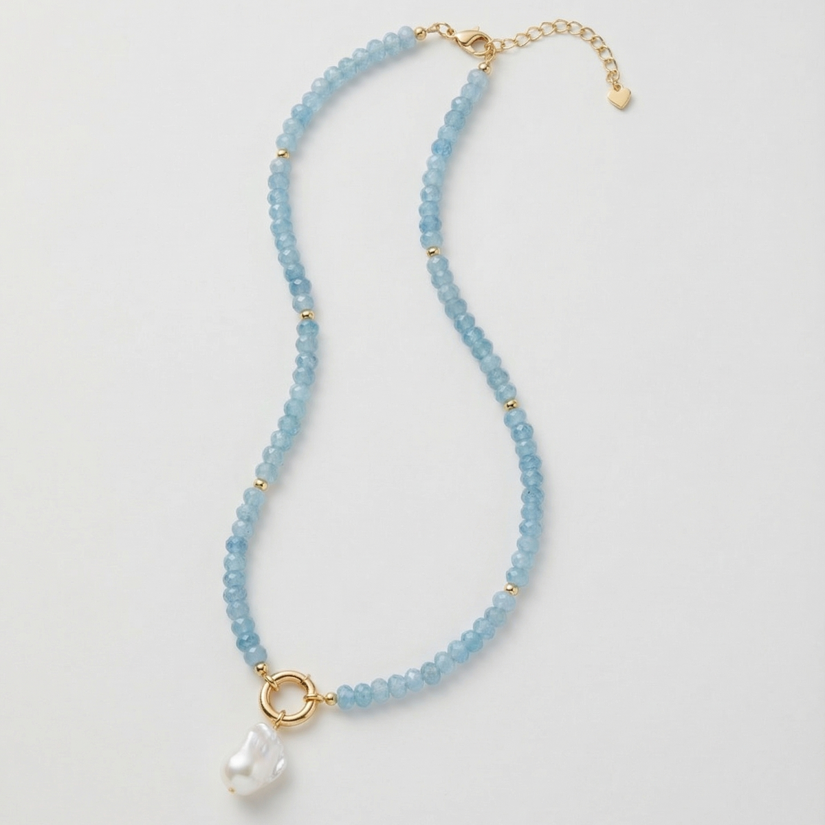 Blue semi-precious gemstone beaded necklace with freshwater baroque pearl pendant and gold accents