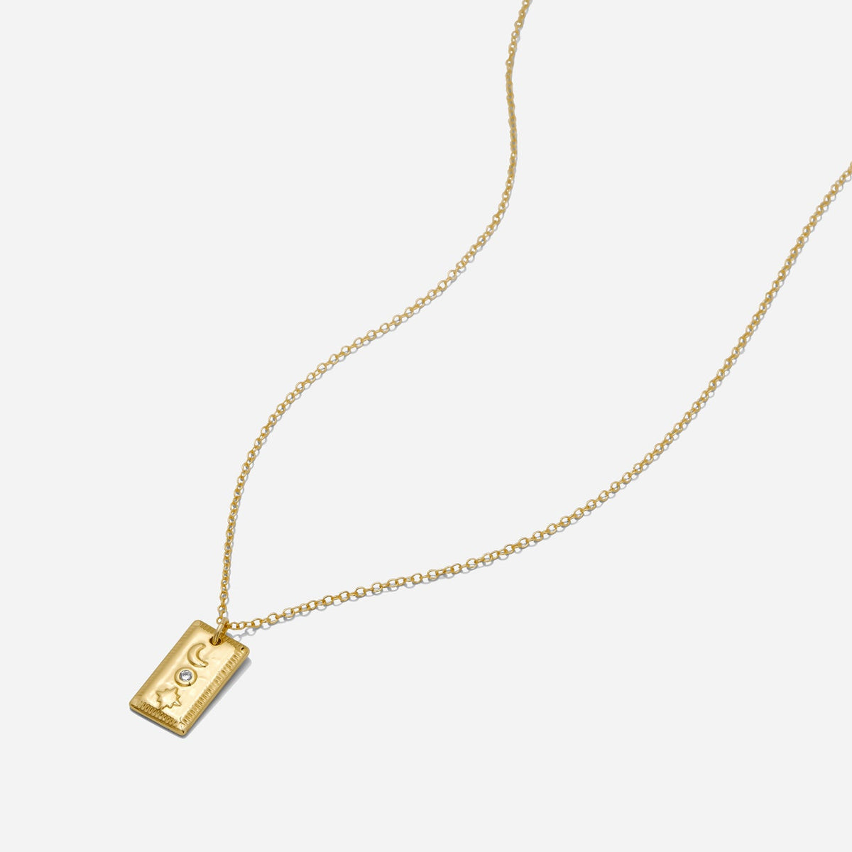 Gold rectangular pendant necklace with crescent moon, star, and CZ stone on an 18-inch gold filled chain made by Katie Dean Jewelry.
