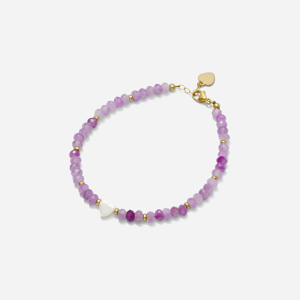 Purple semi precious gemstone beaded bracelet with gold fill bead accents and a dainty white pearl heart charm on a white background, handmade by Katie Dean Jewelry in Clearwater, Florida.