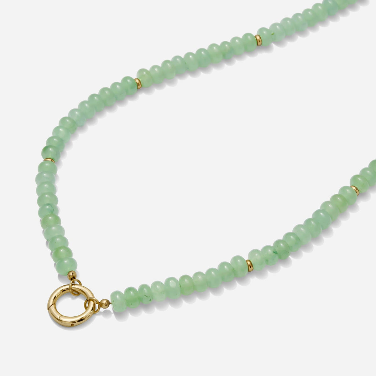 Green beaded necklace with a gold carabiner clasp on a white background handmade by Katie Dean Jewelry