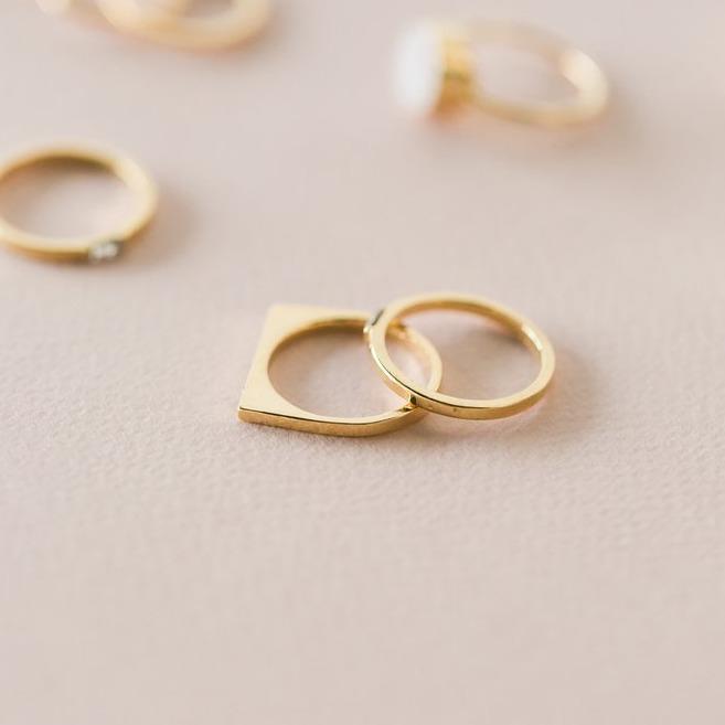 Image showing the Bar with Gem Ring on a pink background made by Katie Dean Jewelry