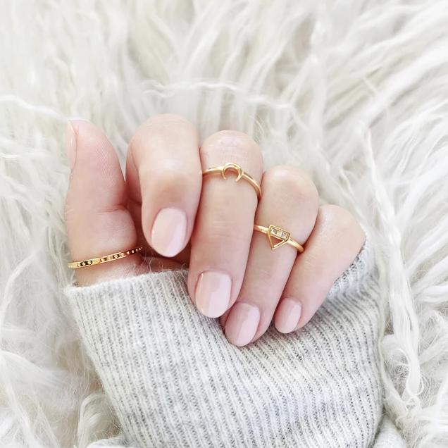 The dainty Moon Ring is worn wonderfully alone or stacked with others and adds the perfect bohemian touch to your look.