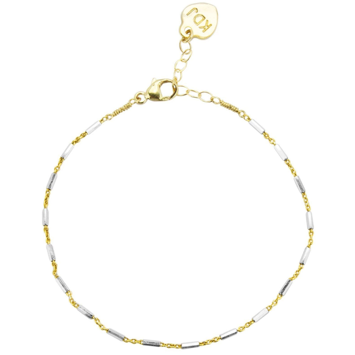 Silver and gold came together to form the perfect friendship in the form of this dainty bracelet. Silver and gold lovers alike agree on this one! Handmade in California by Katie Dean Jewelry.