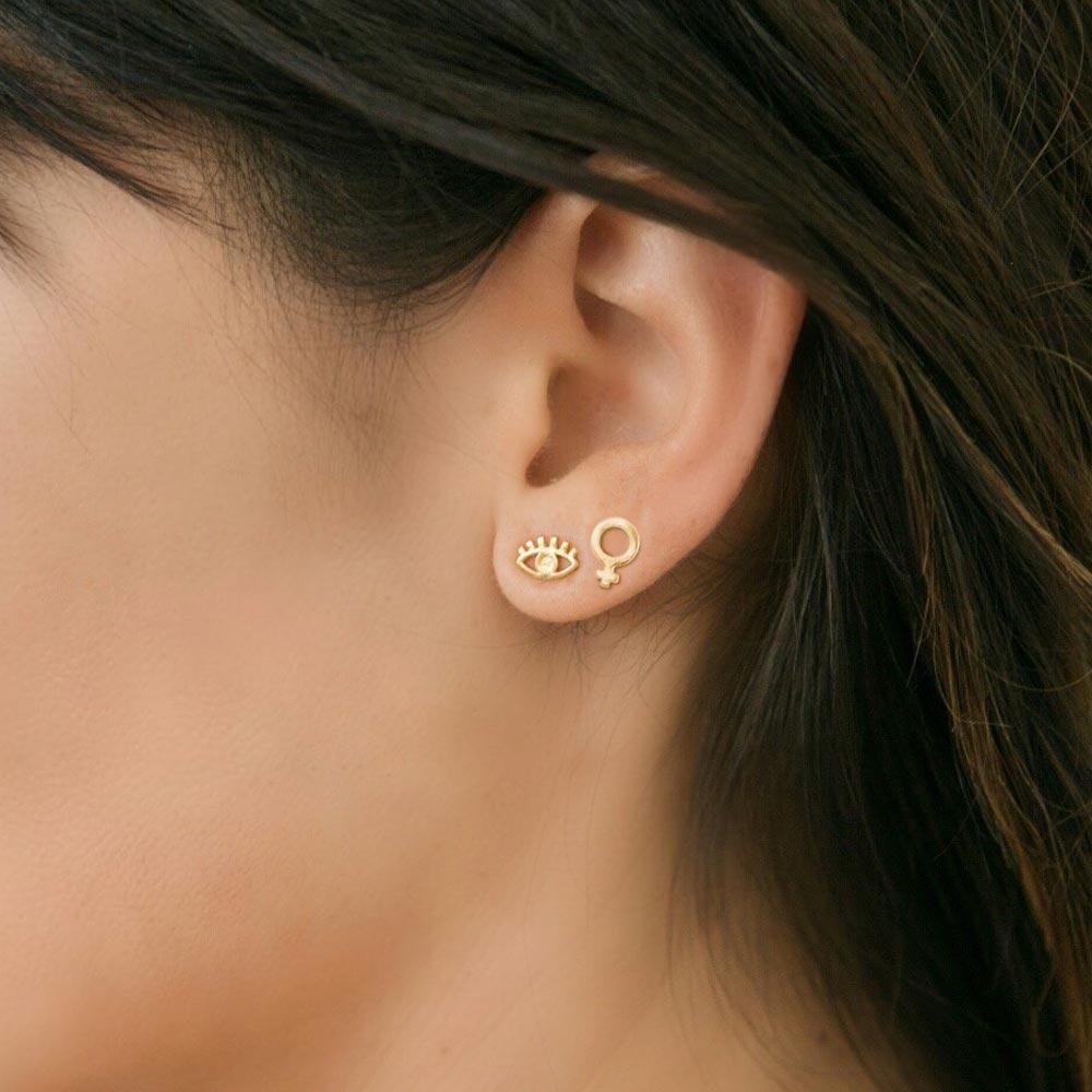 Katie Dean Jewelry model wearing Evil Eye and Female Symbol Studs.