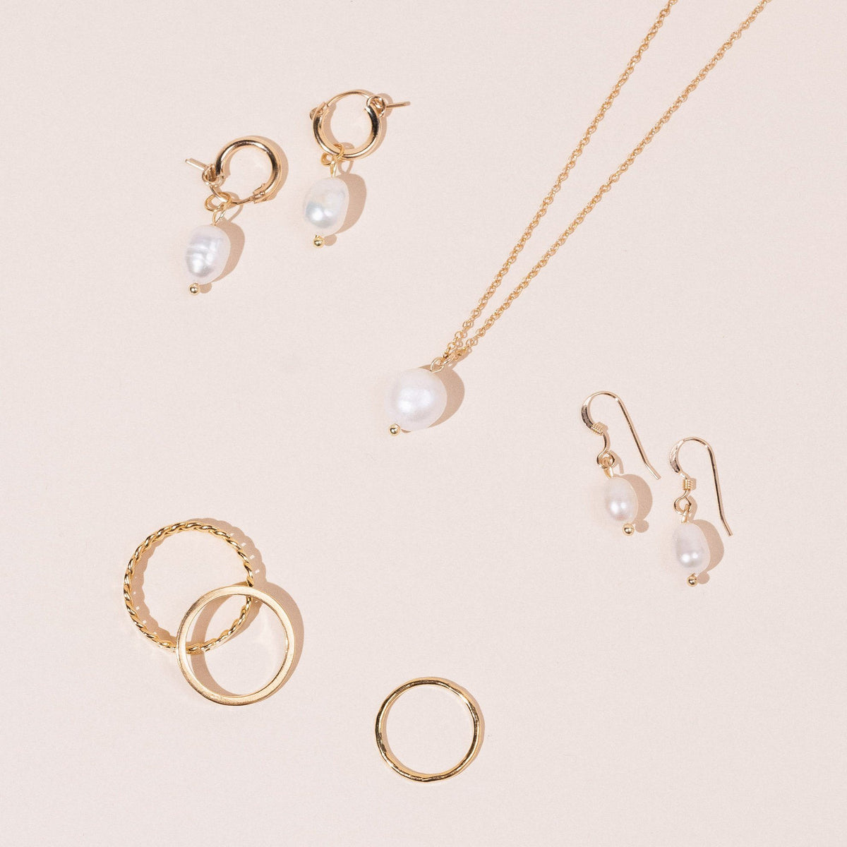 Pearl Collection, dainty gold minimal necklace, ring, hoop earrings and pearl drop earrings handmade in America by Katie Dean Jewelry