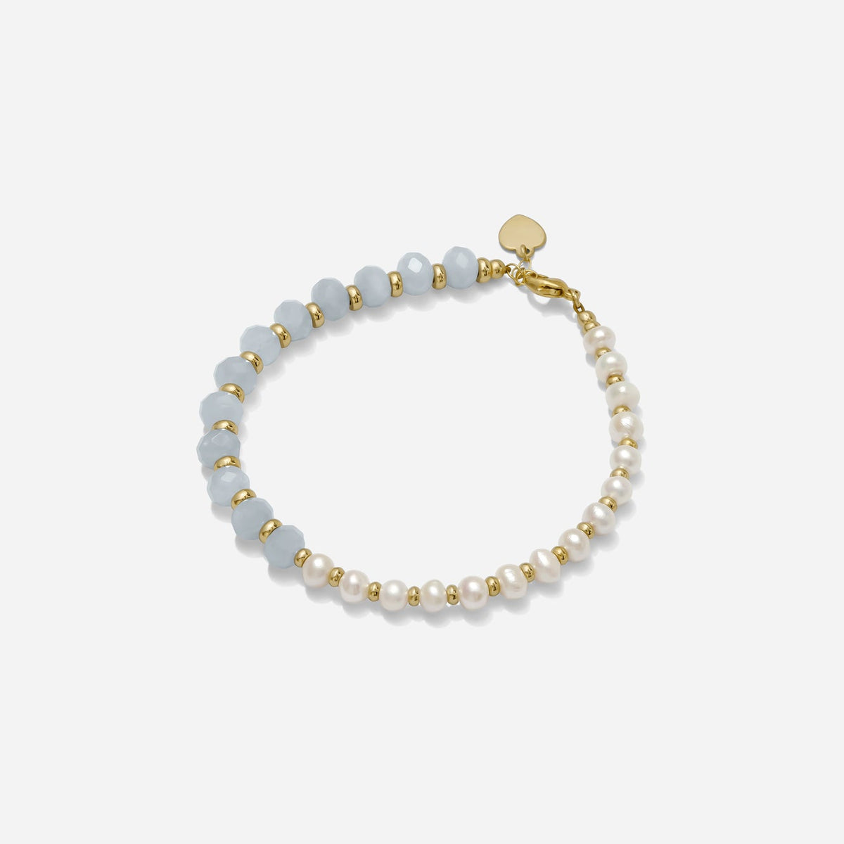 The Asymmetrical Pearl & Blue Gemstone Bracelet combines luminous freshwater pearls with faceted blue semi-precious gemstones for a look that feels modern, effortless, and subtly unexpected, shown on a white background, hand beaded by Katie Dean Jewelry.