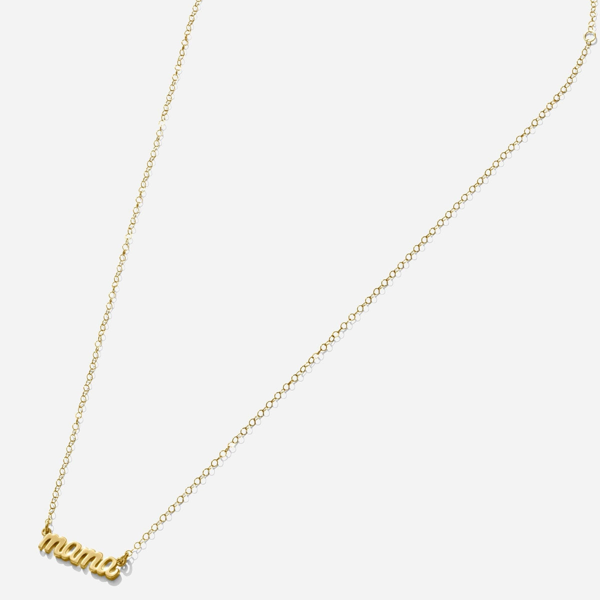 Gold Mama Necklace handmade in America by Katie Dean Jewelry, made in America as seen on a natural white background, perfect for the dainty minimal jewelry lovers.