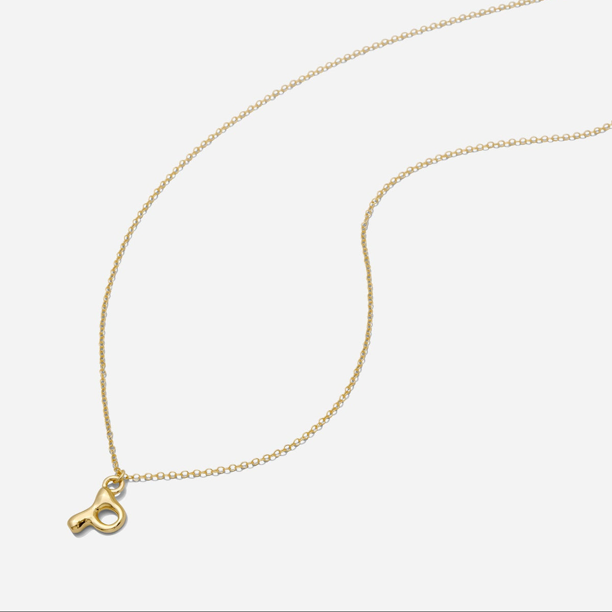 Dainty Gold puffy initial "P" pendant necklace on an 18-inch gold filled chain as seen on a white background.