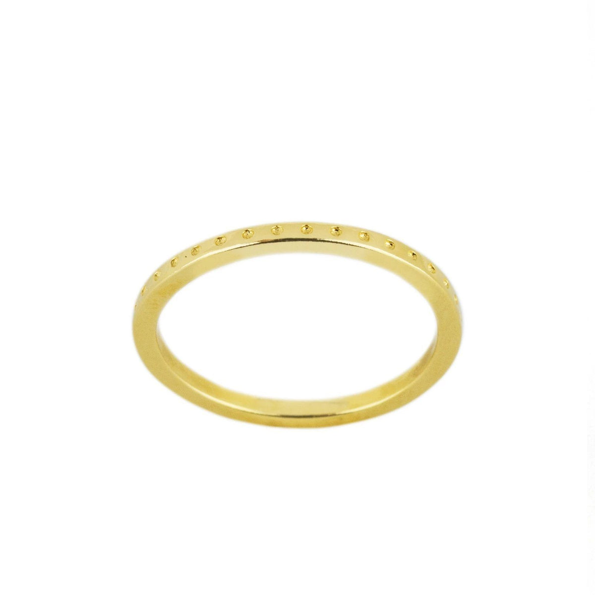 A lovely stacking ring, the Dotted Ring is perfect for the minimalist who wants to add a little texture to their ring look. Handmade in California by Katie Dean Jewelry.